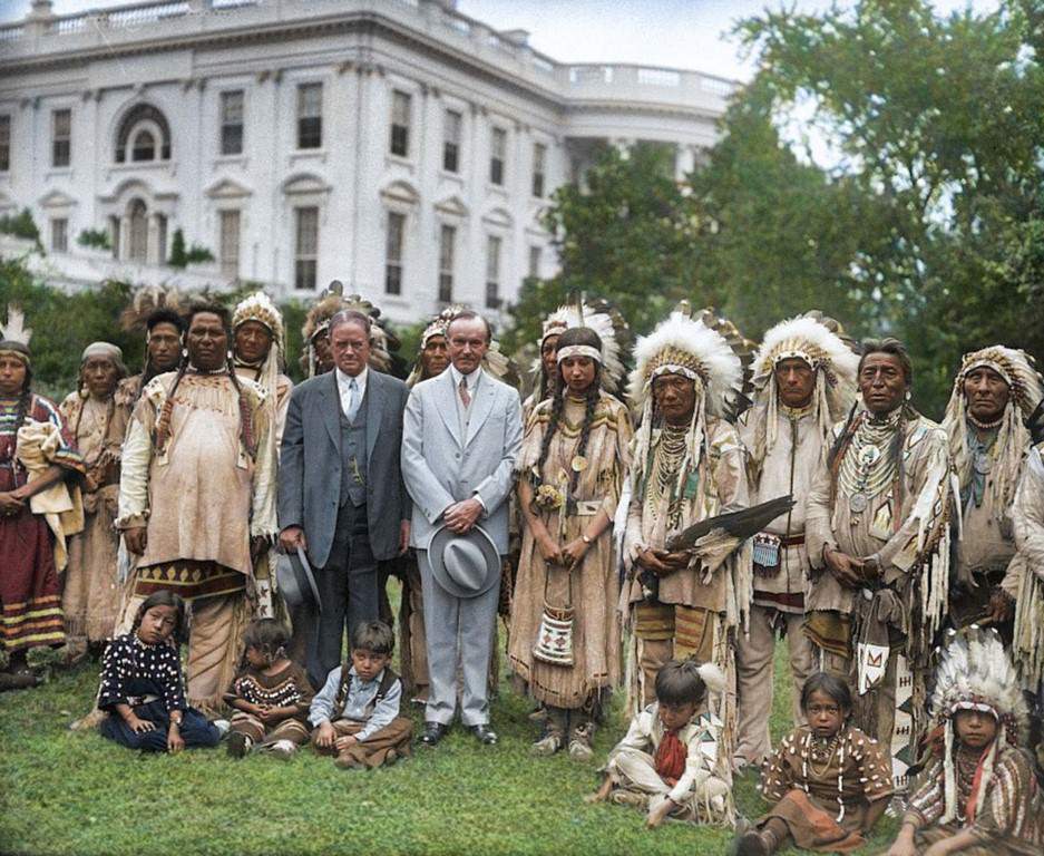 President Calvin Coolidge with a group of Native Americans on the White House lawn.