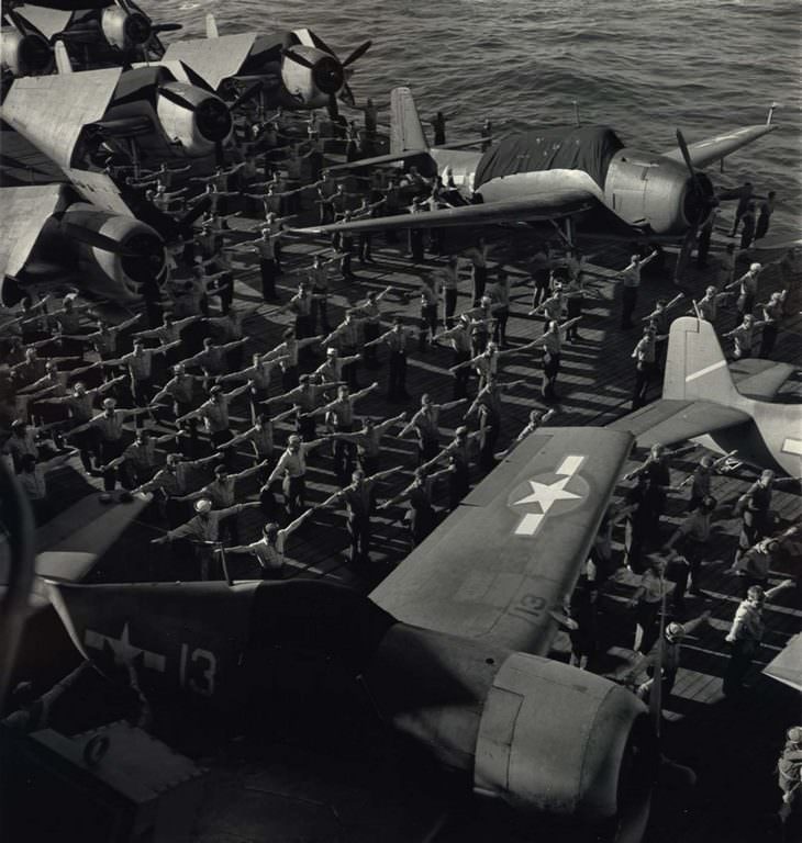 Military Aircraft Aboard U.S.S. Yorktown with Sailors Performing Exercises, 1943.