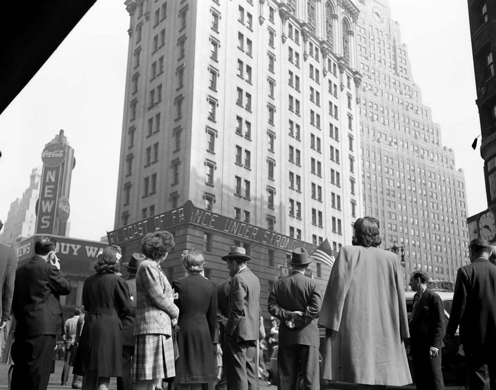 Crowds watching the electronic ticker on the New York Times building in Times Square as they waited for the latest reports.
