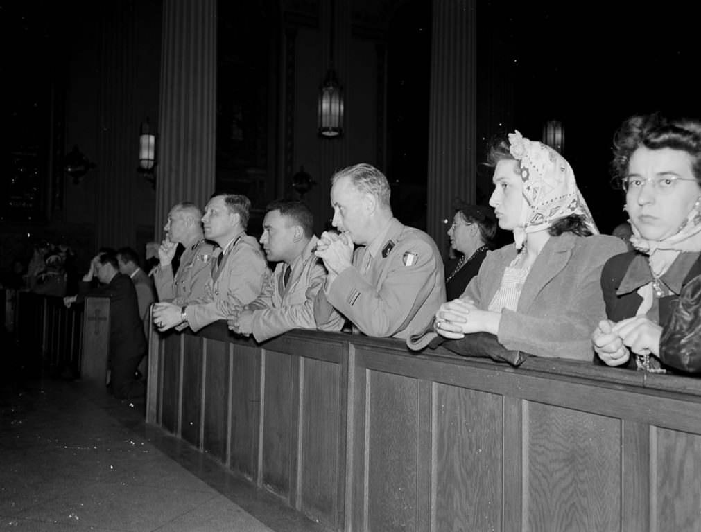 Worshippers pray at noon mass at St. Vincent de Paul’s church on 23rd Street.