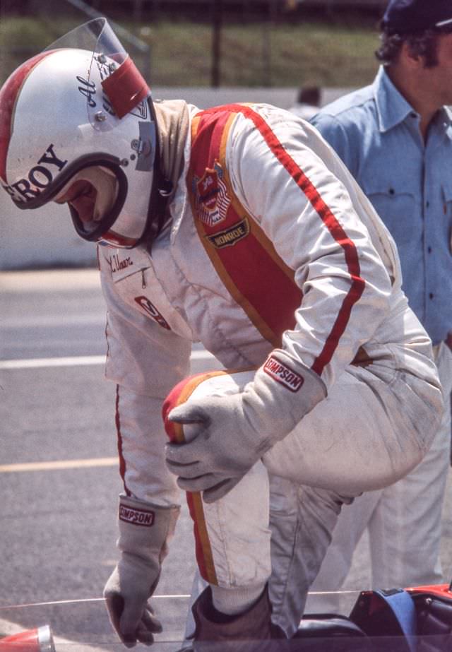 Al Unser enters his car