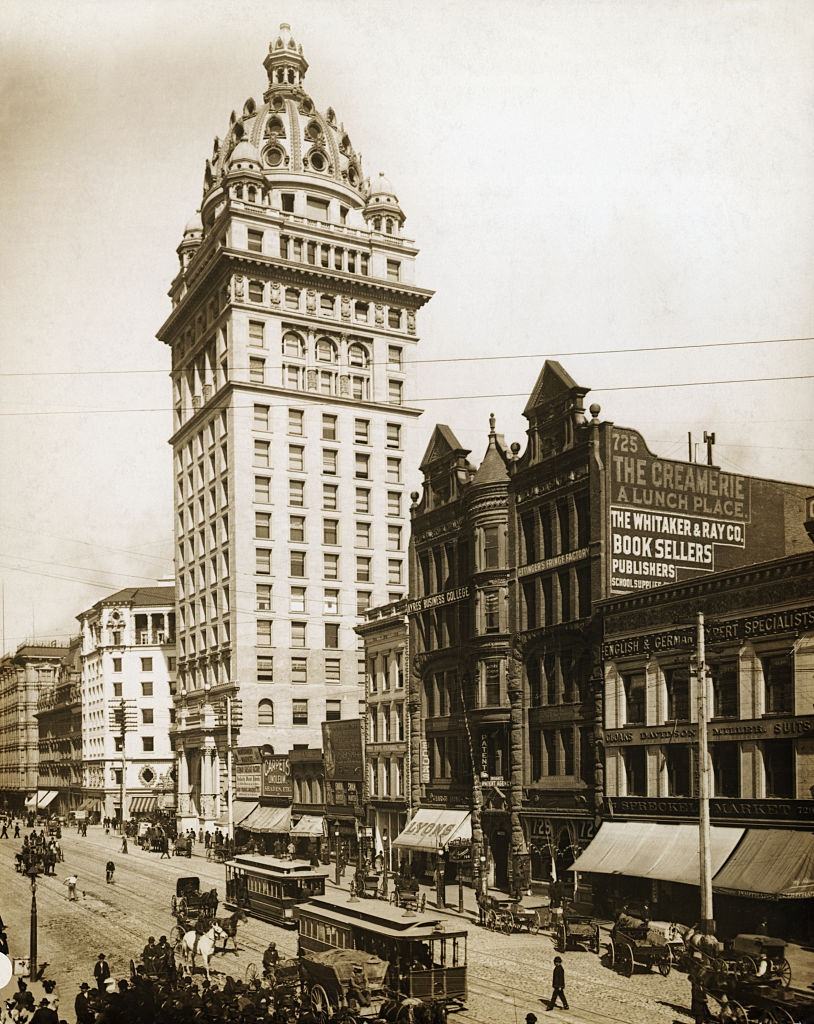 Market Street in San Francisco, 1898. The largest here is the Call Building. Street shows trolley cars, horses and carriages.