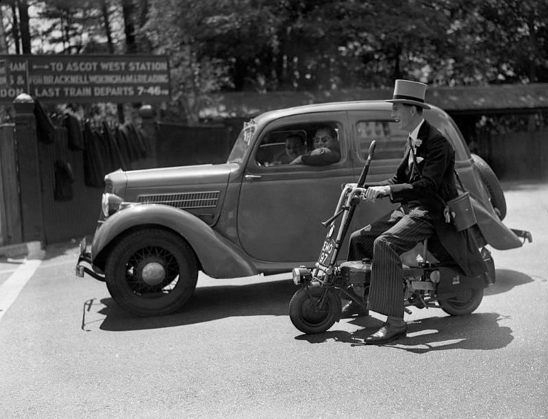 A man riding a Brockhouse Corgi moped at Ascot racecourse.