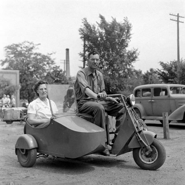 A couple on a scooter.