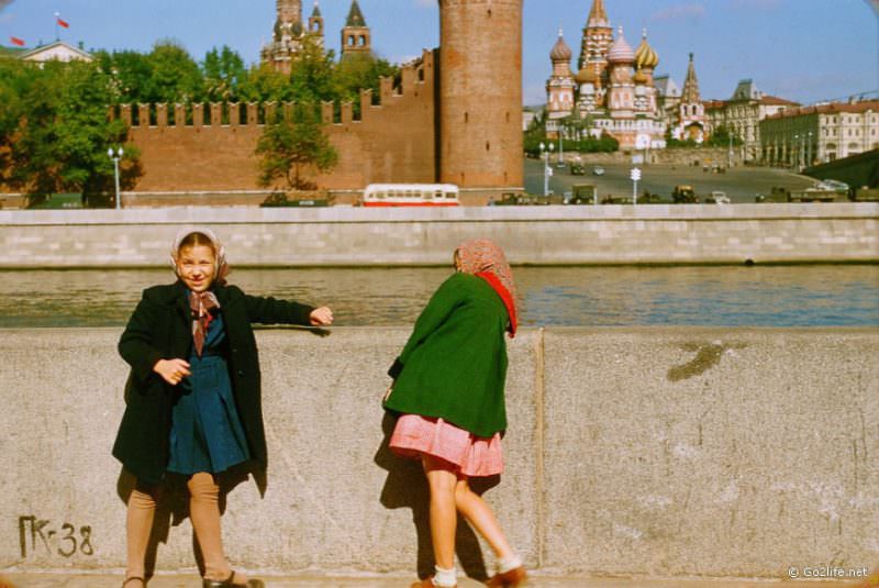 Two soviet girls standing at the Moscow river embankment, the 1950s