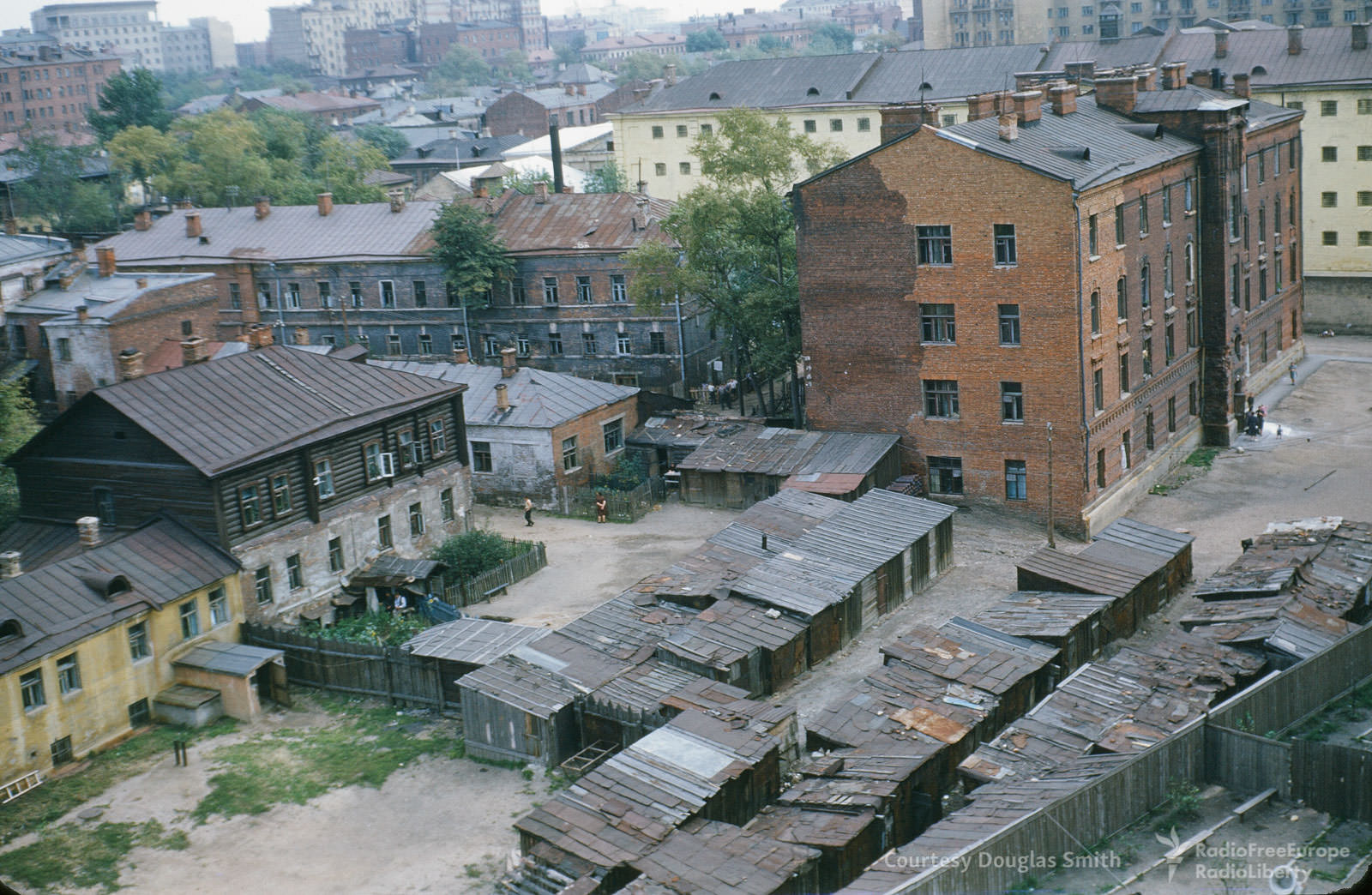 Log-topped housing and ramshackle sheds topped with corrugated steel in Moscow's Tagansky raion.