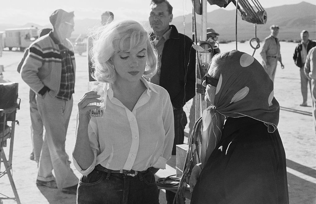 Marilyn Monroe with her acting coach Paula Strasberg, the wife of 'method' teacher Lee Strasberg on the set of 'The Misfits'.