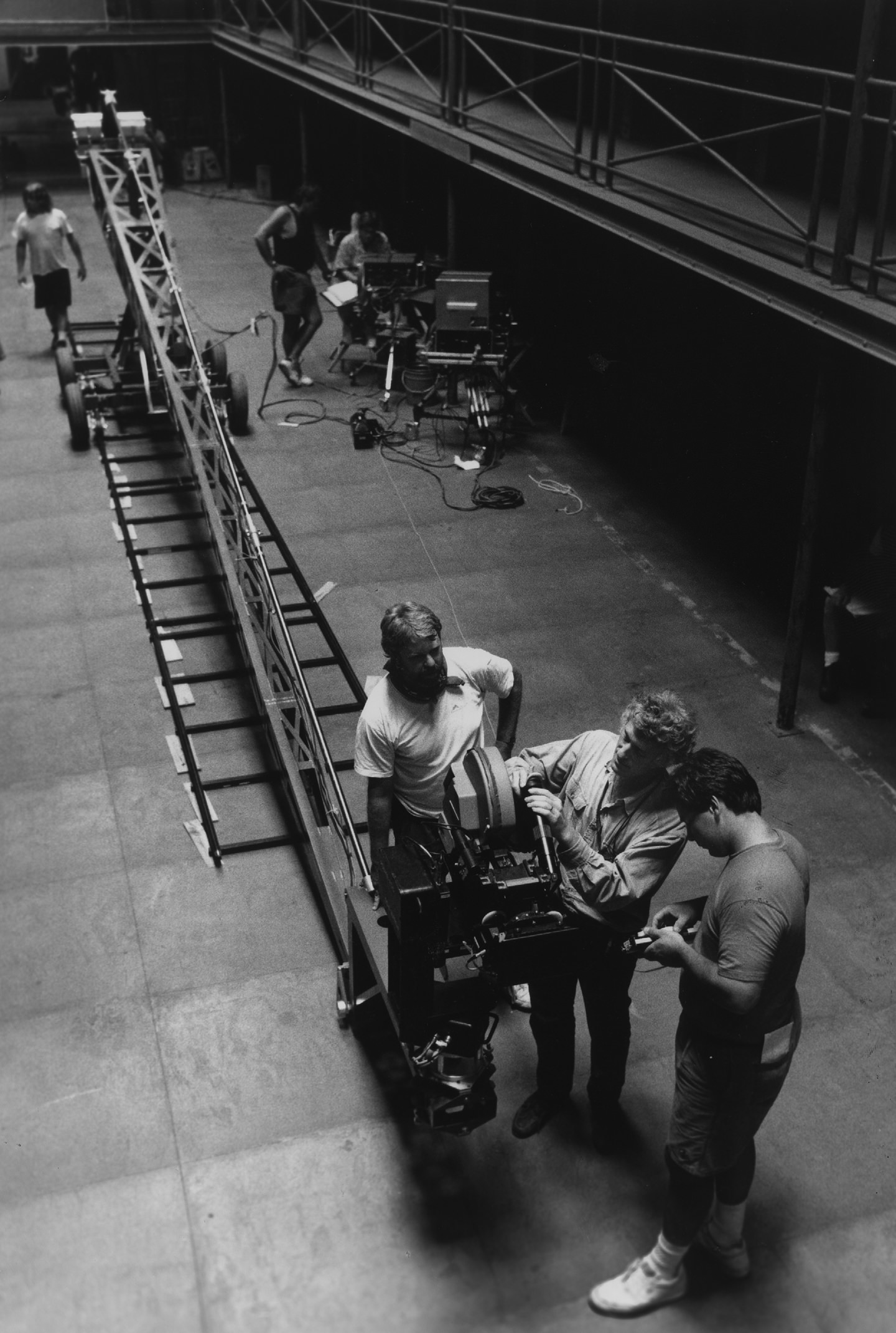 Deakins and his crew plot a crane shot inside the cell block set.