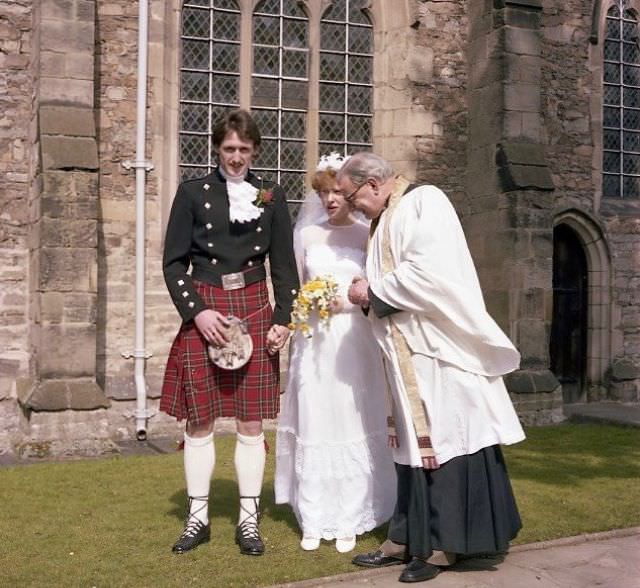 Bride and groom with priest