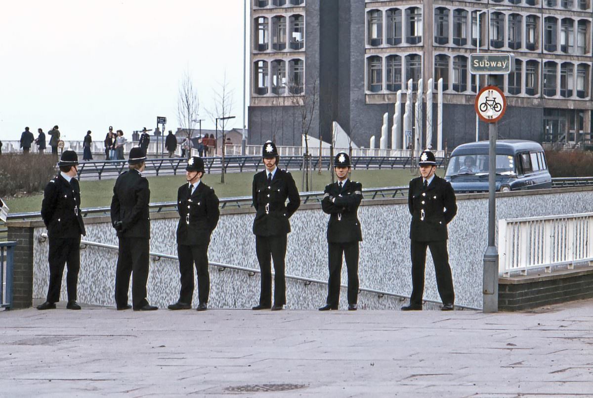 A group of policemen wait on Wolverhampton ring road prior to the passing of an anti-racist demonstration procession. 11th March 1978