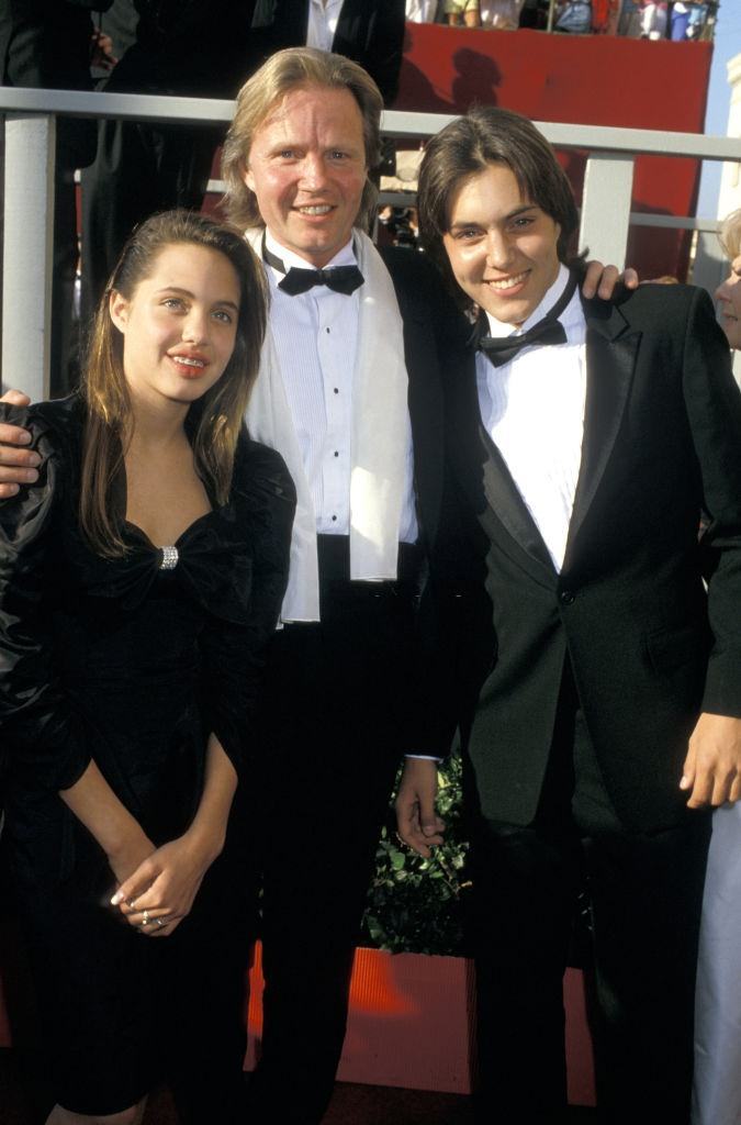 Angelina Jolie with her father and brother at 60th Annual Academy Awards, 1988.