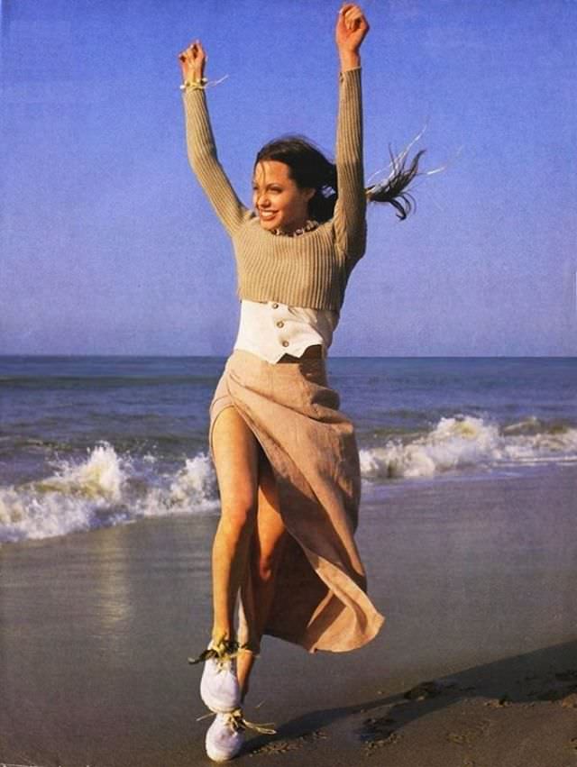 Angelina Jolie chilling on the beach, 1993.