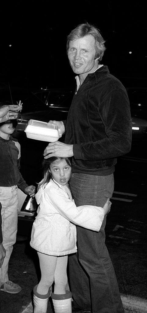 Angelina Jolie with her father and brother, 1981.
