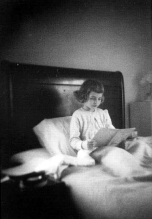 A young Debbie Harry reading a book, early 1950s
