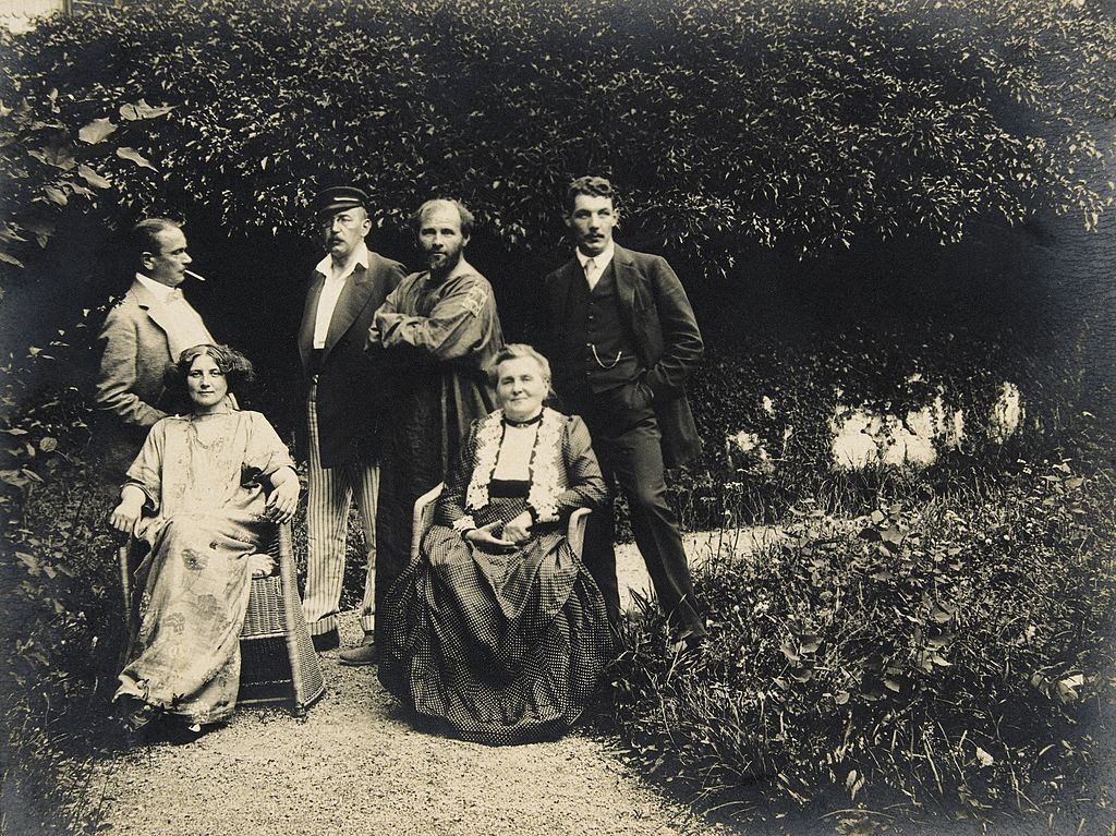Gustav Klimt, Emilie Floege and her mother Barbara with friends in the garden of the Oleander villa in Kammer at the Attersee lake. Austria, 1908.