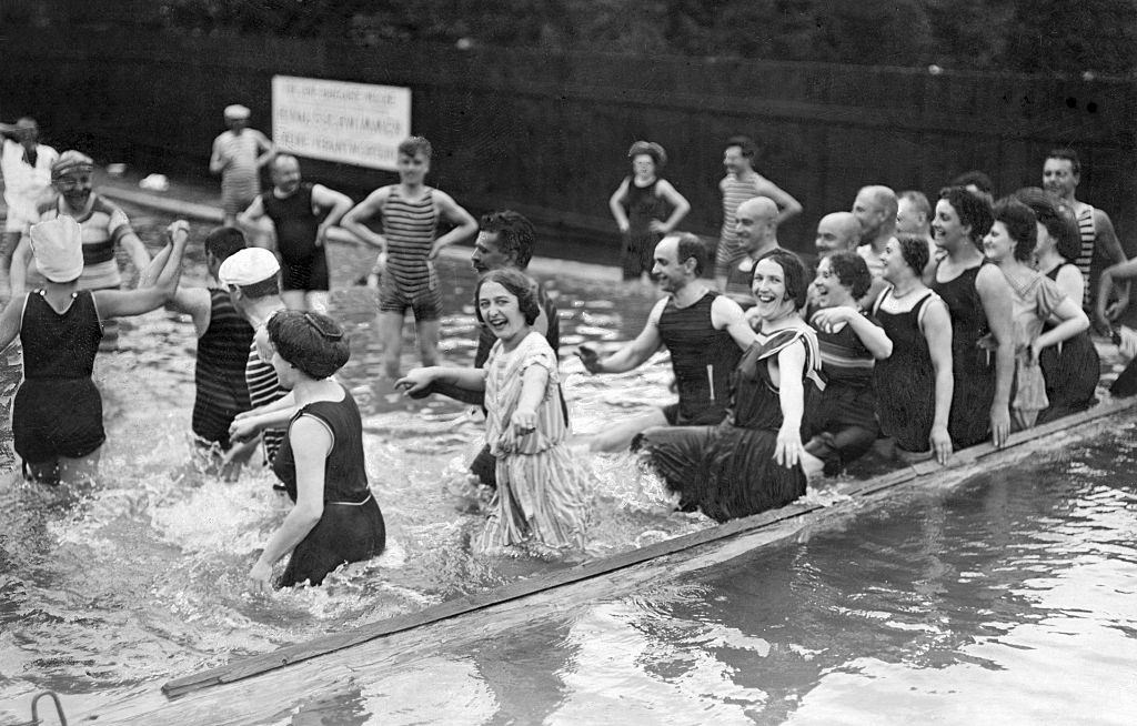 Bathers having fun in the water at the Danube in Vienna, 1909.