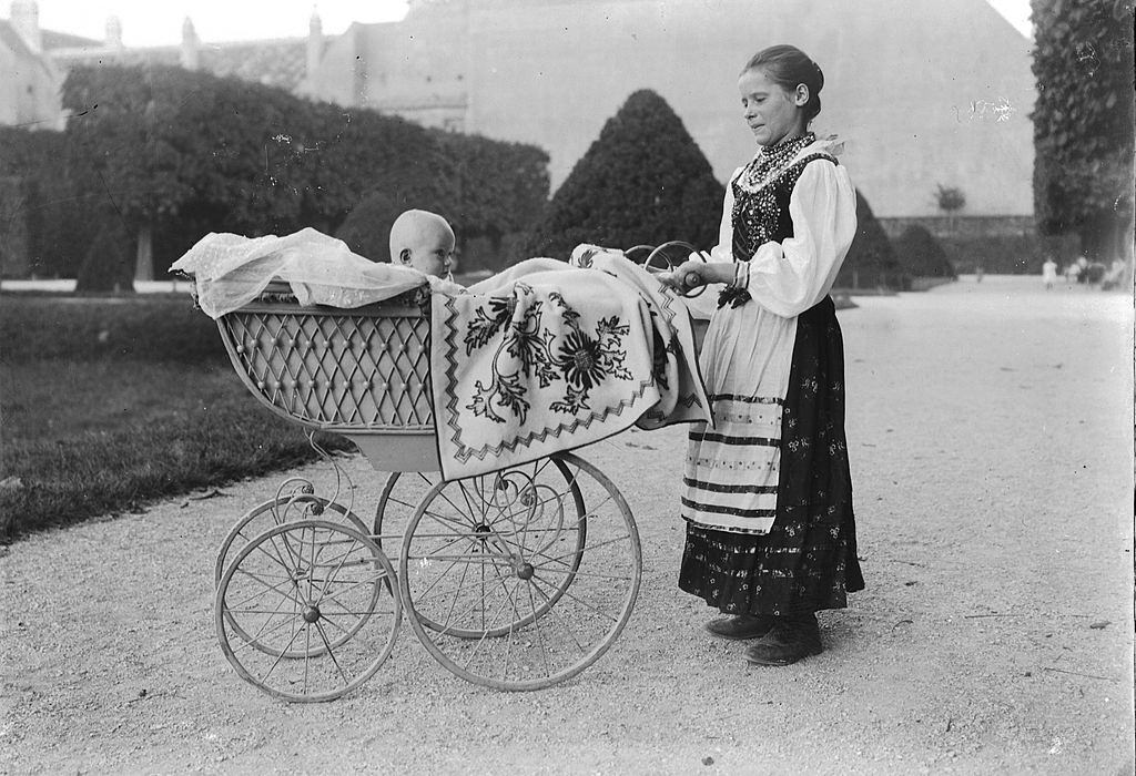 A mother with her baby out for a walk in Vienna, 1900.