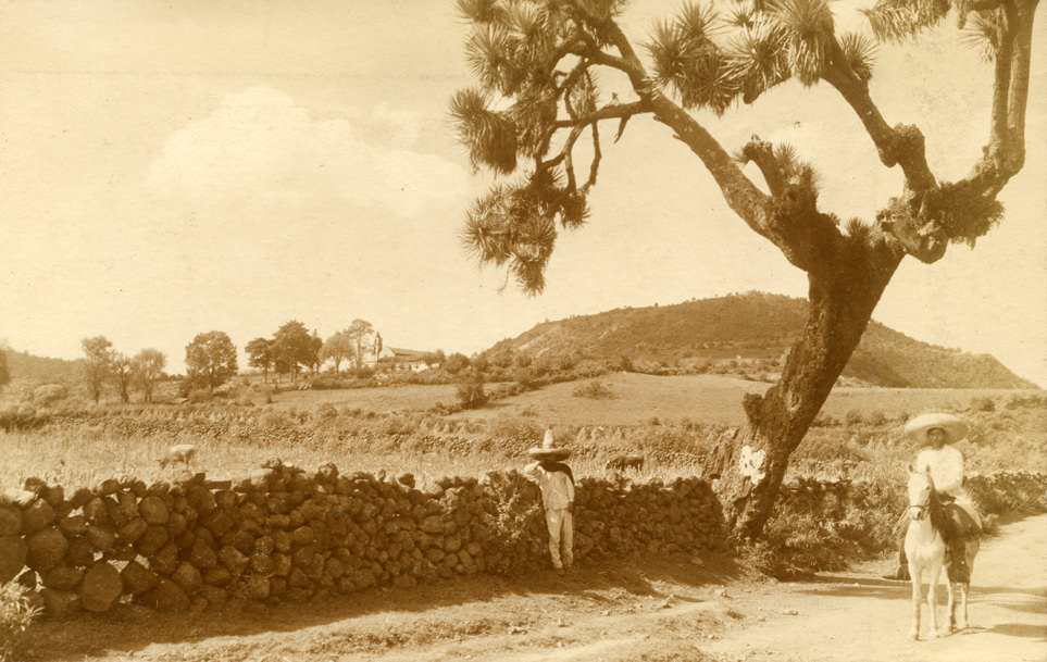 Men beside stone wall. Mexico, 1905