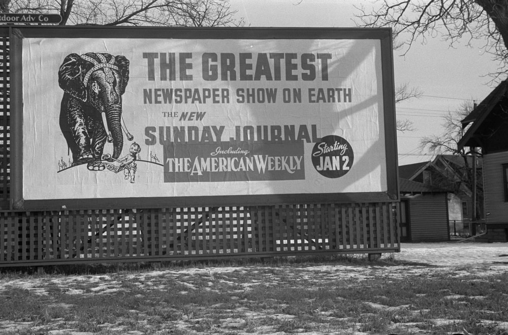This billboard from 1937 advertises for the Minneapolis Journal newspaper.
