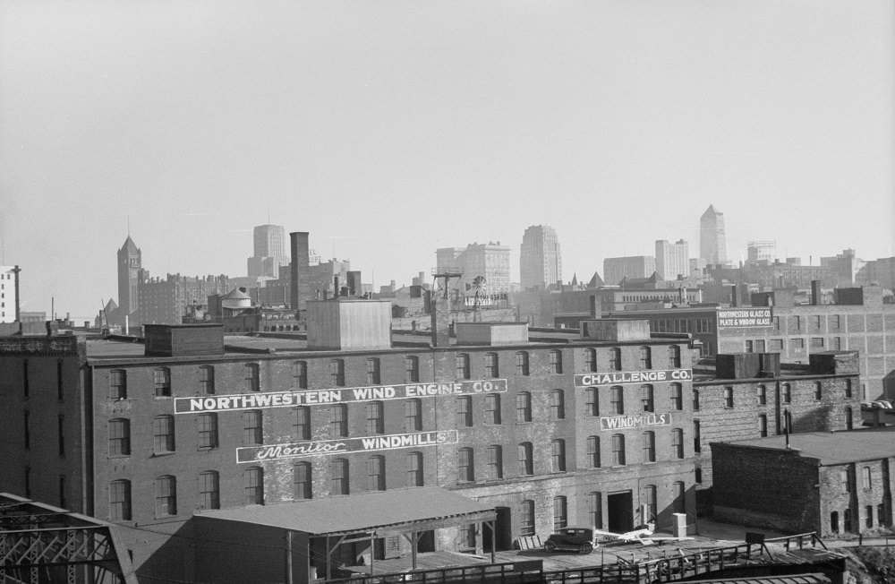 Skyline with windmill company in foreground, Minneapolis, 1930s.