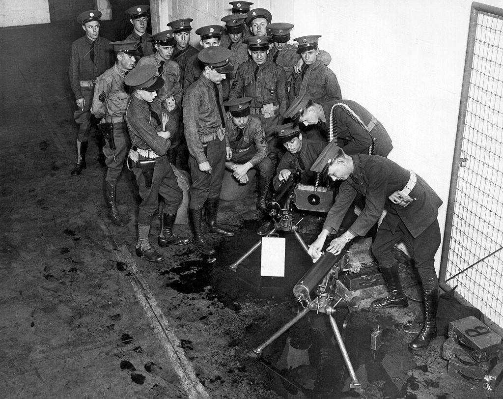 National Guardsmen as they oil and clean machines guns, Minneapolis, 1934.