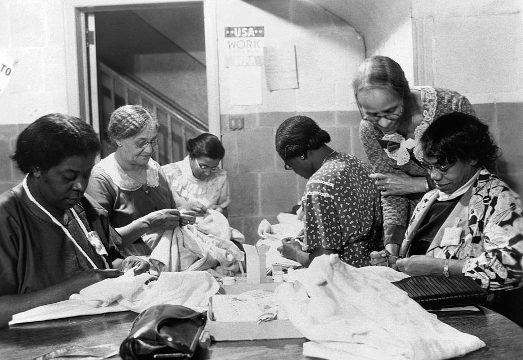 A group of elderly women work on projects at the Phyllis Wheatley Settlement House in Minneapolis, 1936.