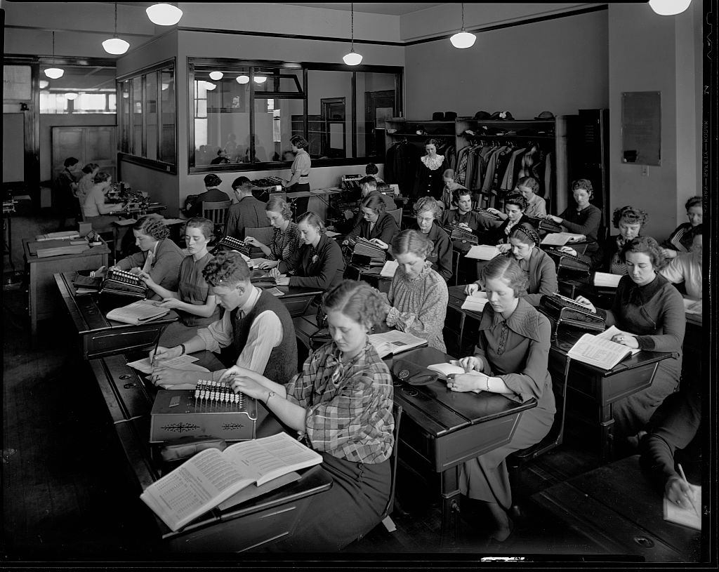 Young men and women practice clerical skills in a classroom at the Minnesota Business College in May 1936.