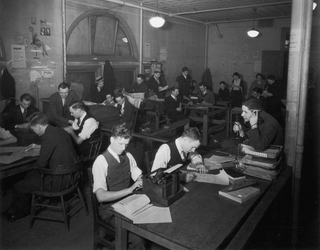 Students at work in the offices of the 'Minnesota Daily', the campus newspaper of the University of Minnesota, 1932.