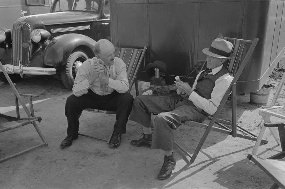 Tourists traveling in trailers talking in camp, McAllen, Texas, February 1939.