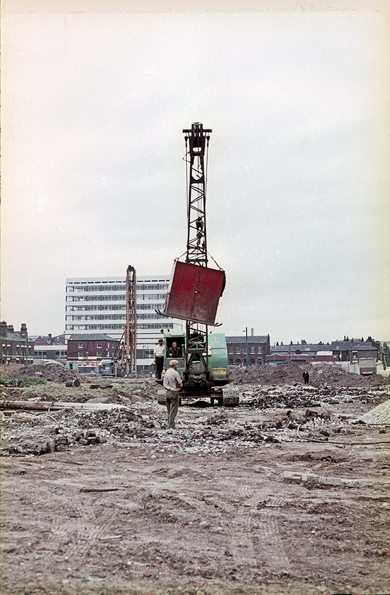 Preliminary construction work taking place on open ground on the east side of Hulme, around 1967.