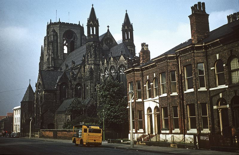 View along Ackers Street towards Oxford Road, showing the Church of the Holy Name from the south east, 1960s.