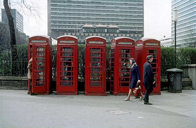 A group of five 'K6' public telephone boxes at the edge Piccadilly Gardens, Manchester, around 1969.