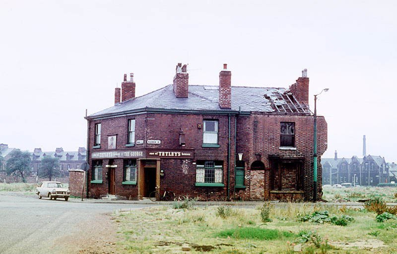 The George Inn on the junction of Radnor Street and Pinder Street, Hulme, left isolated by the demolition of surrounding houses and shops.