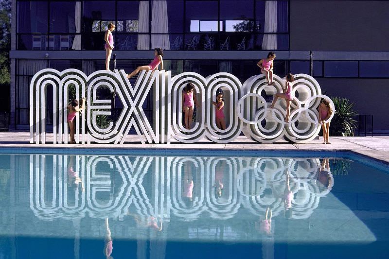 School children playing on Olympic logo Mexico 68.