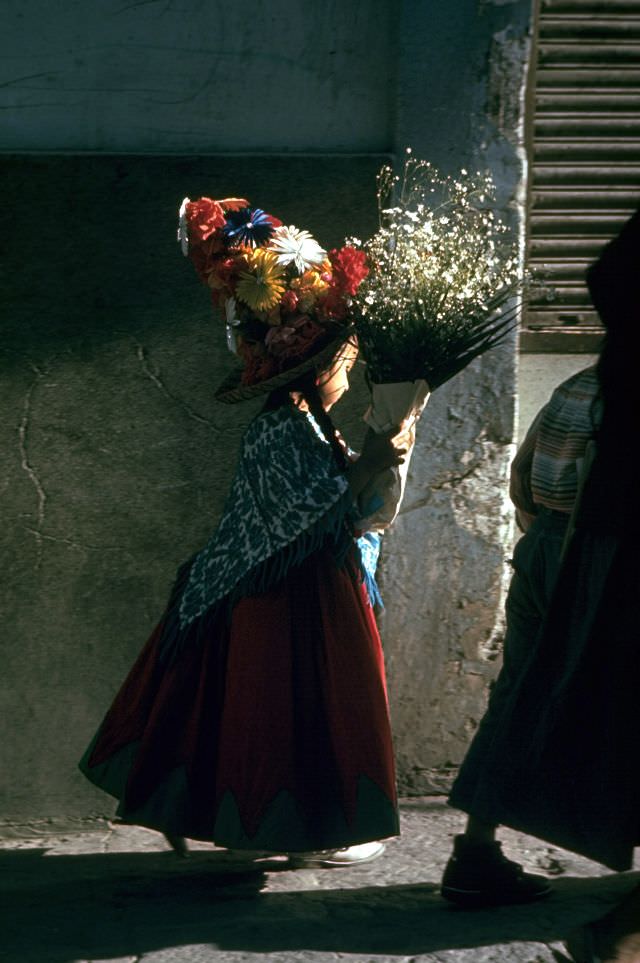 A child carrying bouquet on her way to the fiesta, 1968