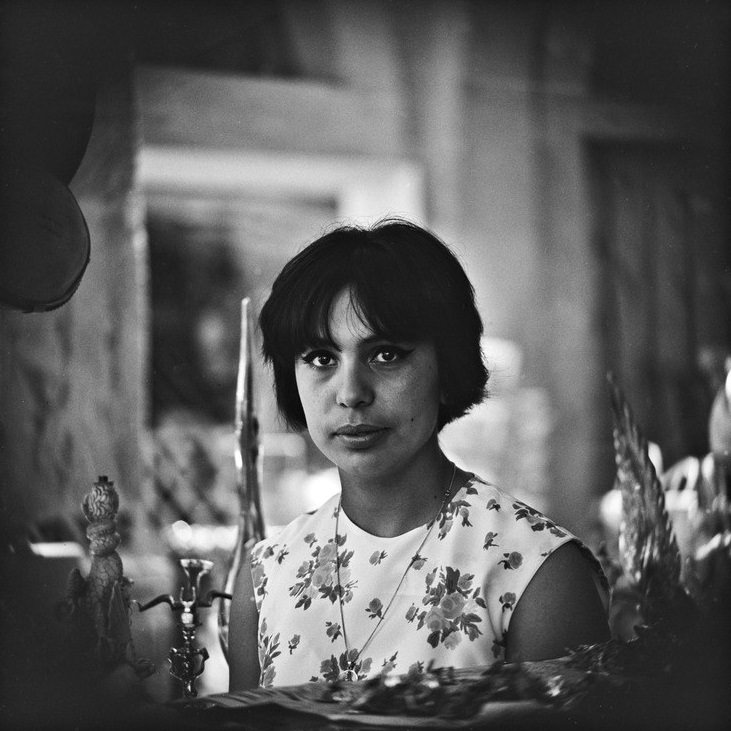 Portrait of young woman in curio shop, 1964