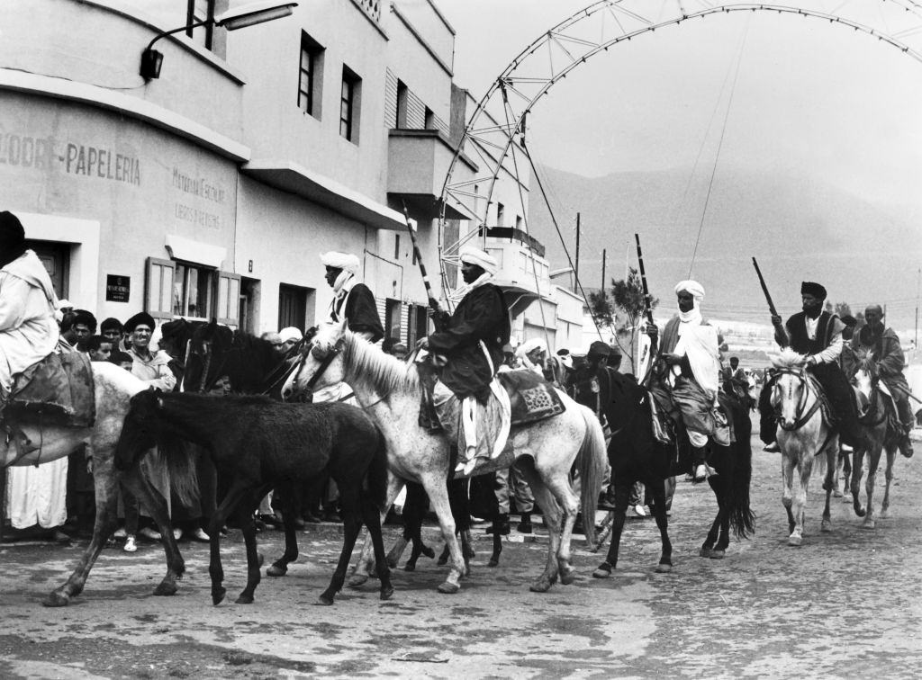 Sidi Ifni inhabitants in traditional costumes enter the city after the departure of Spanish and the return of the territory to Morocco, on July 08, 1969.