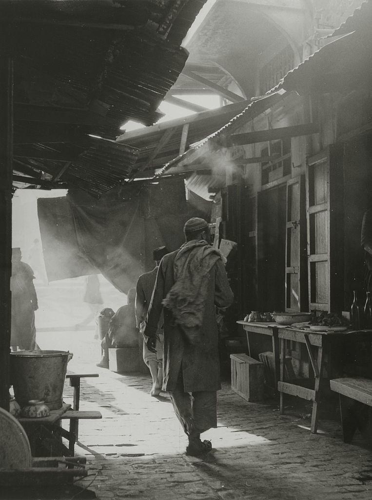 A narrow covered streets that lead to the central square in Morocco, 1960.