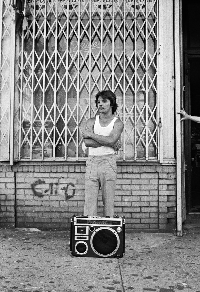 A young man with a BoomBox on 18th Street, 1970s.