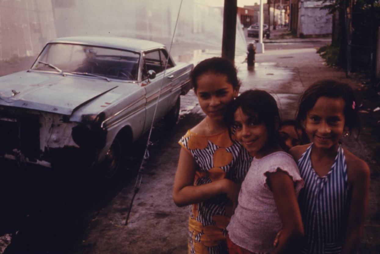 Three young girls on Bond Street, Brooklyn, July 1974.