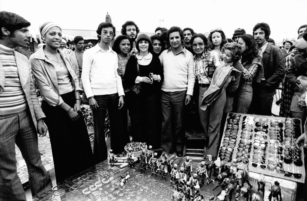 Mireille Mathieu surrounded by her fans at Jemaa el-Fna square on May 2, 1976 in Marrakech, Morocco.