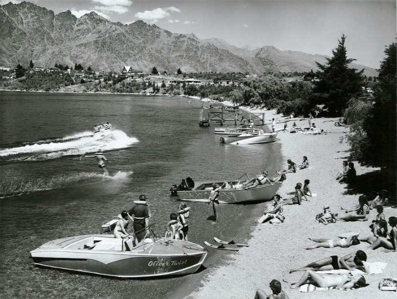 Summer beach scene at Kelvin Grove, Frankton Arm, Lake Wakatipu, Otago, January 1971