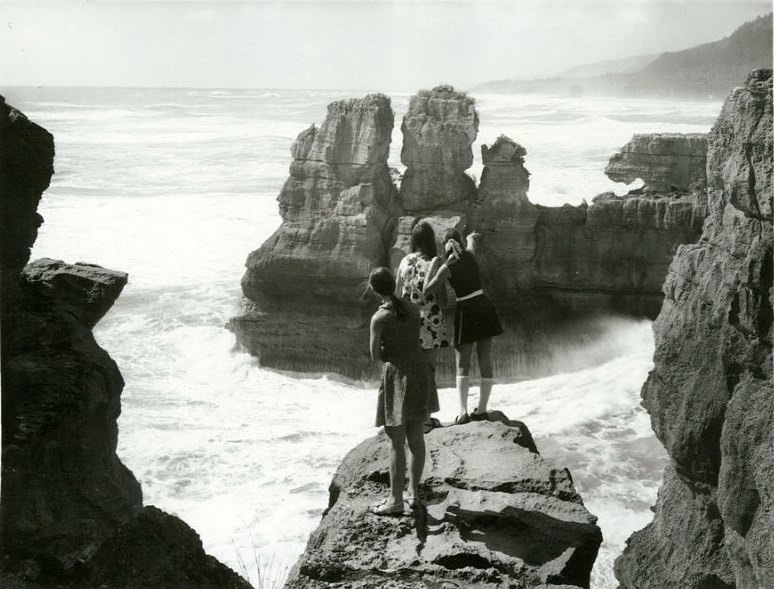 Punakaiki, Nelson Province. Looking North. Girls on the Stratified rock formation high above the sea, February 1972