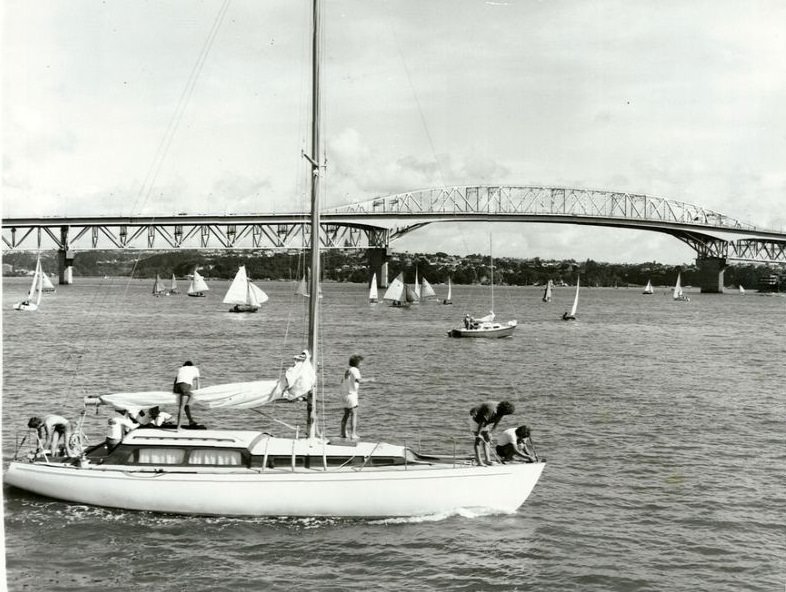 Auckland Harbour Bridge with yachts in harbour, January 1975