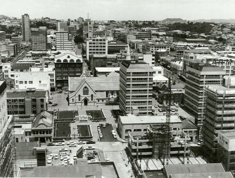 View from Custom Street West towards Central Police station. St. Patrick's in centre foreground, Auckland, December 1975