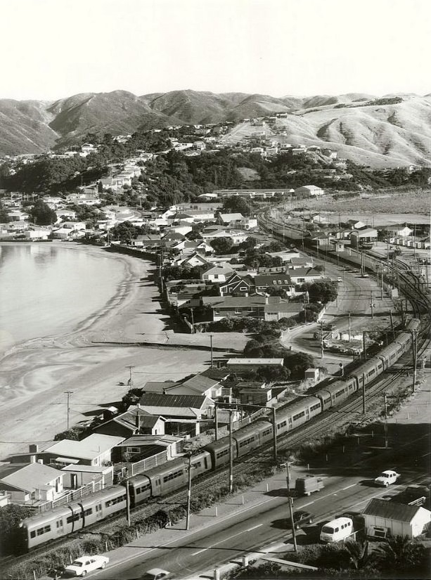 Plimmerton with an electric unit travelling along the main trunk line, January 1975