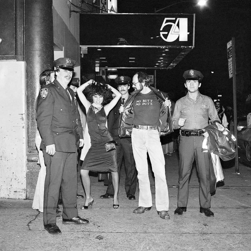 A group of revellers pose as they leave world famous Studio 54