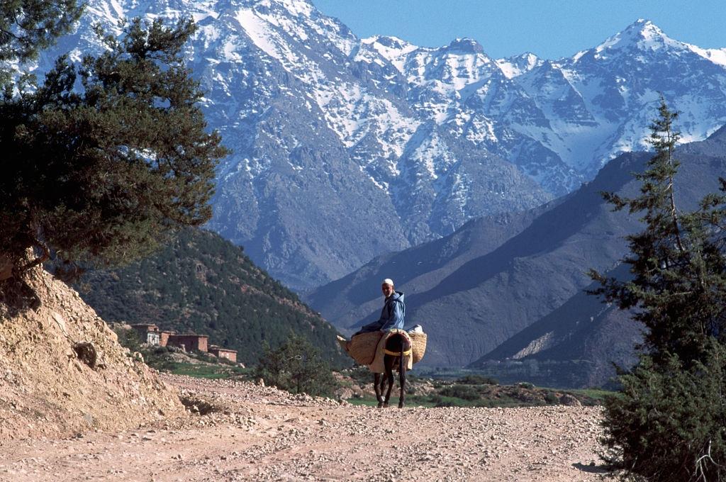 Berber rides through Toubkal Mountains, 1980s.