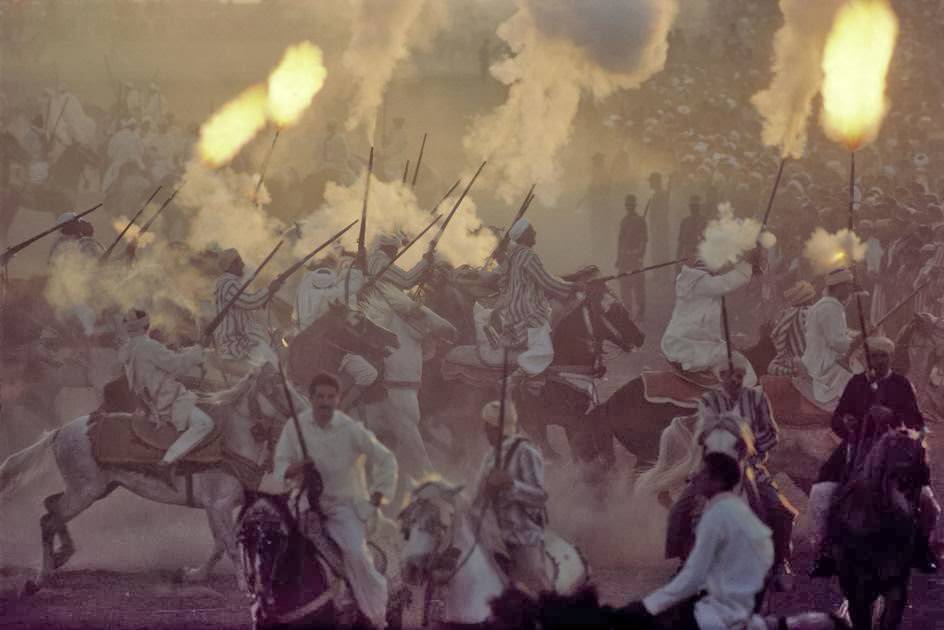 Horsemen performing a 'fantasia' race, during a wedding, 1984.
