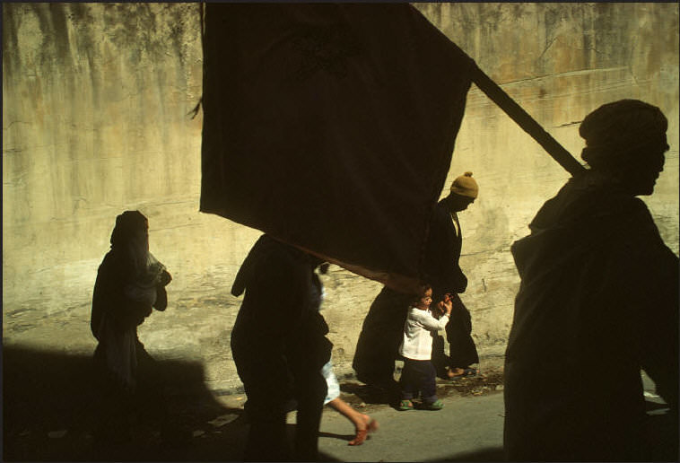 Pilgrims with banners making their way to the Mosque during the Moussem, traditional feast of the month of September, 1988.